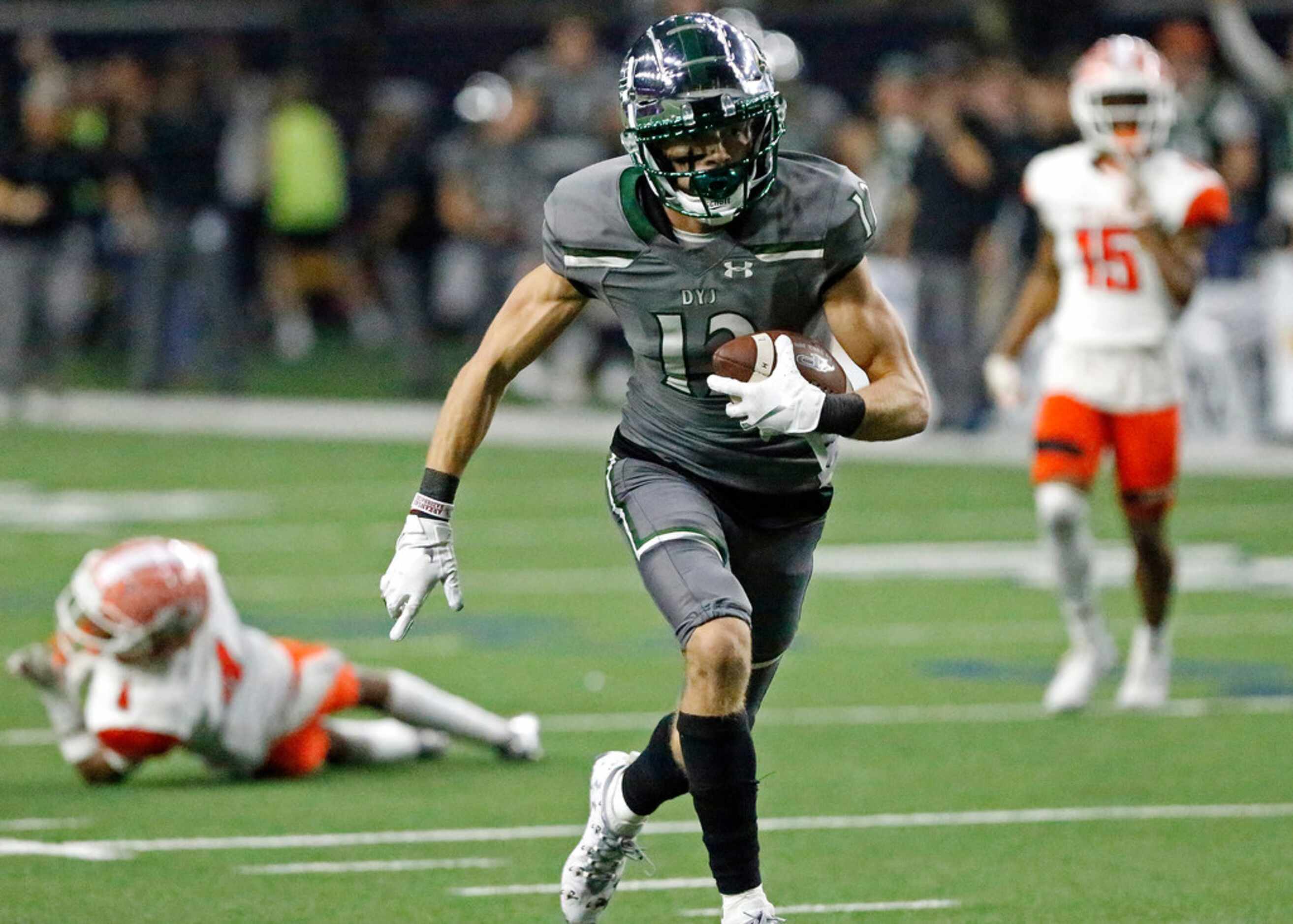 Prosper High School wide receiver Hayden Metcalf (12) scores a touchdown on this run after...