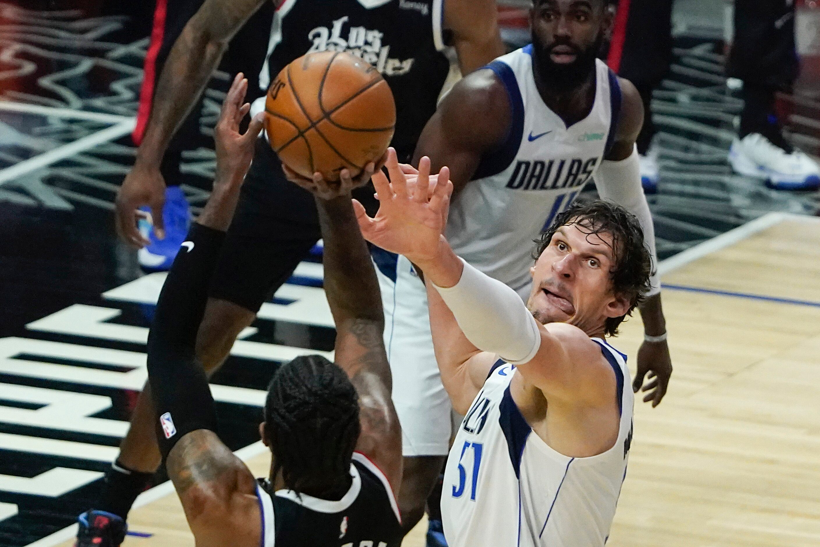 Dallas Mavericks center Boban Marjanovic (51) defends against LA Clippers guard Paul George...