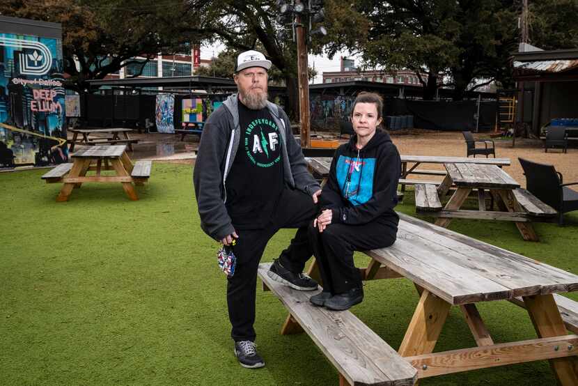 Co-owners John LaRue and wife Kari LaRue of Deep Ellum Art Co. posed in the patio area of...