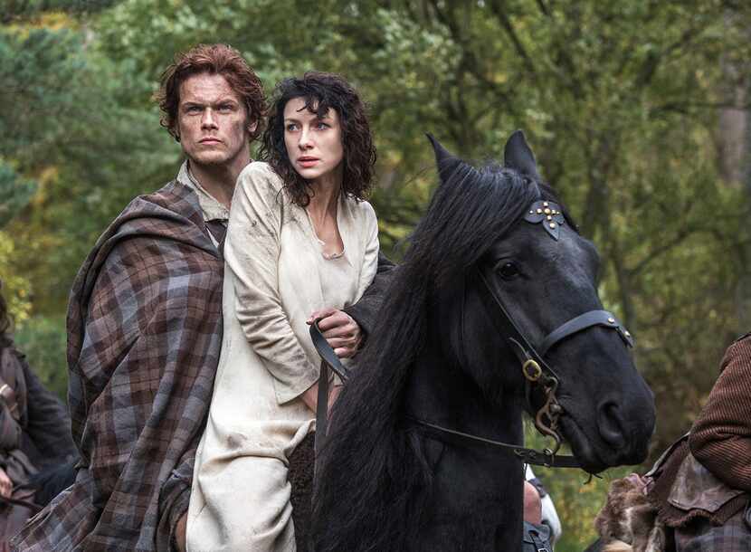 Caitriona Balfe stars as Claire and Sam Heughan plays her future husband, Jamie, in a scene...