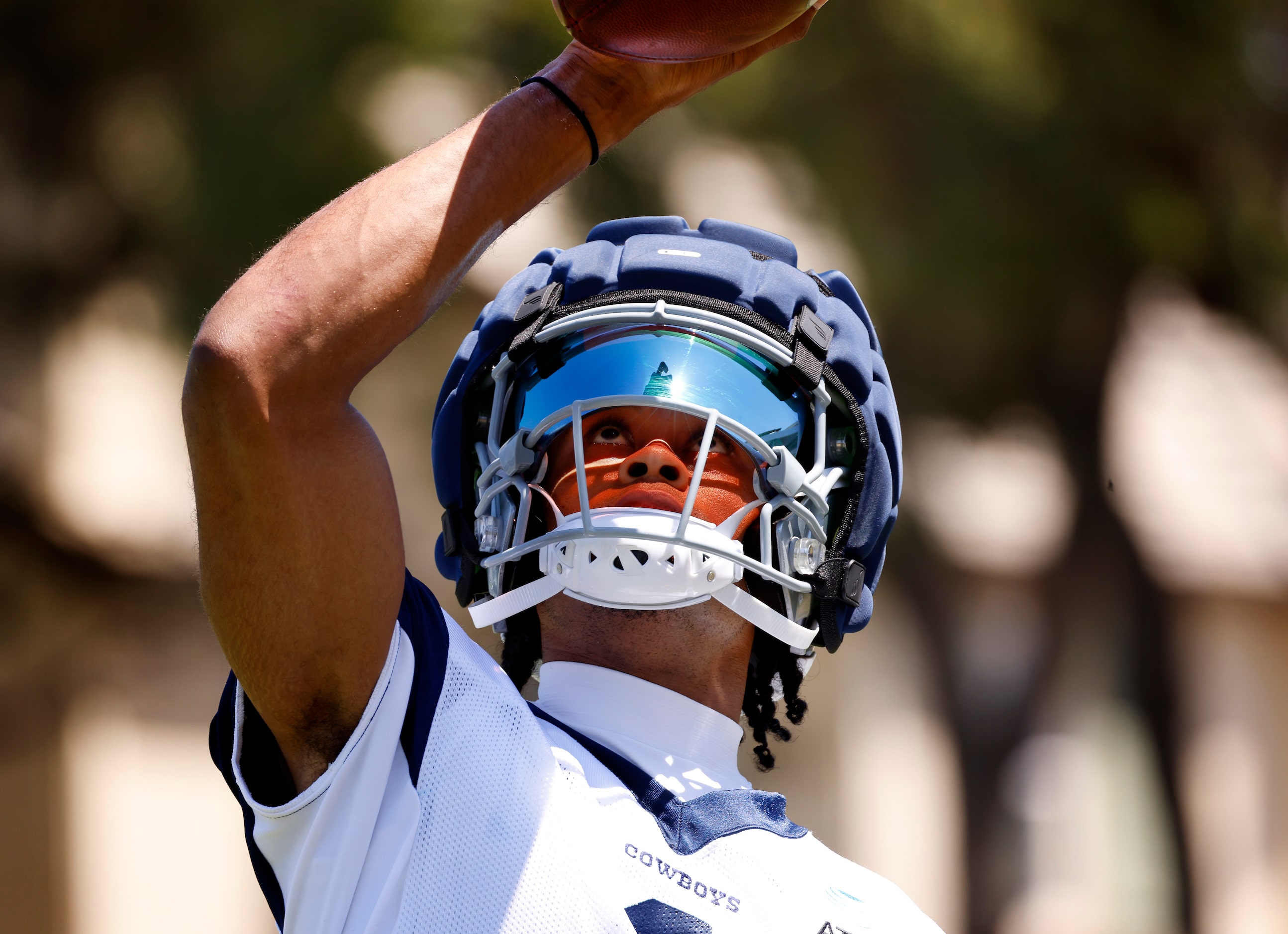 Dallas Cowboys wide receiver Jalen Tolbert (1) catches a one-handed pass as he looks through...