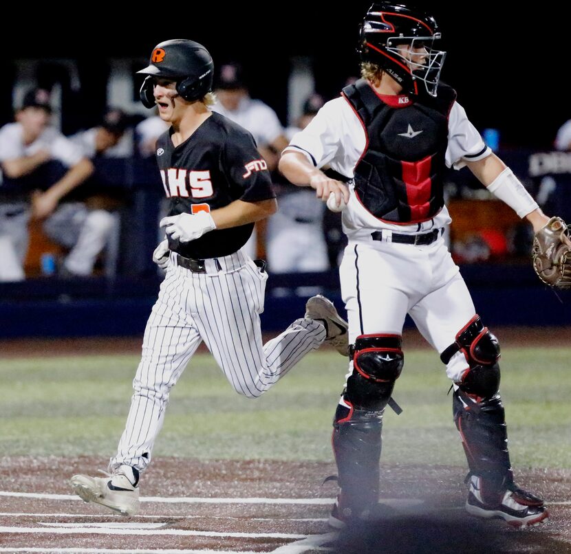 Rockwall shortstop Brayden Randle (2) scores on a bases loaded walk in the fifthl inning as...