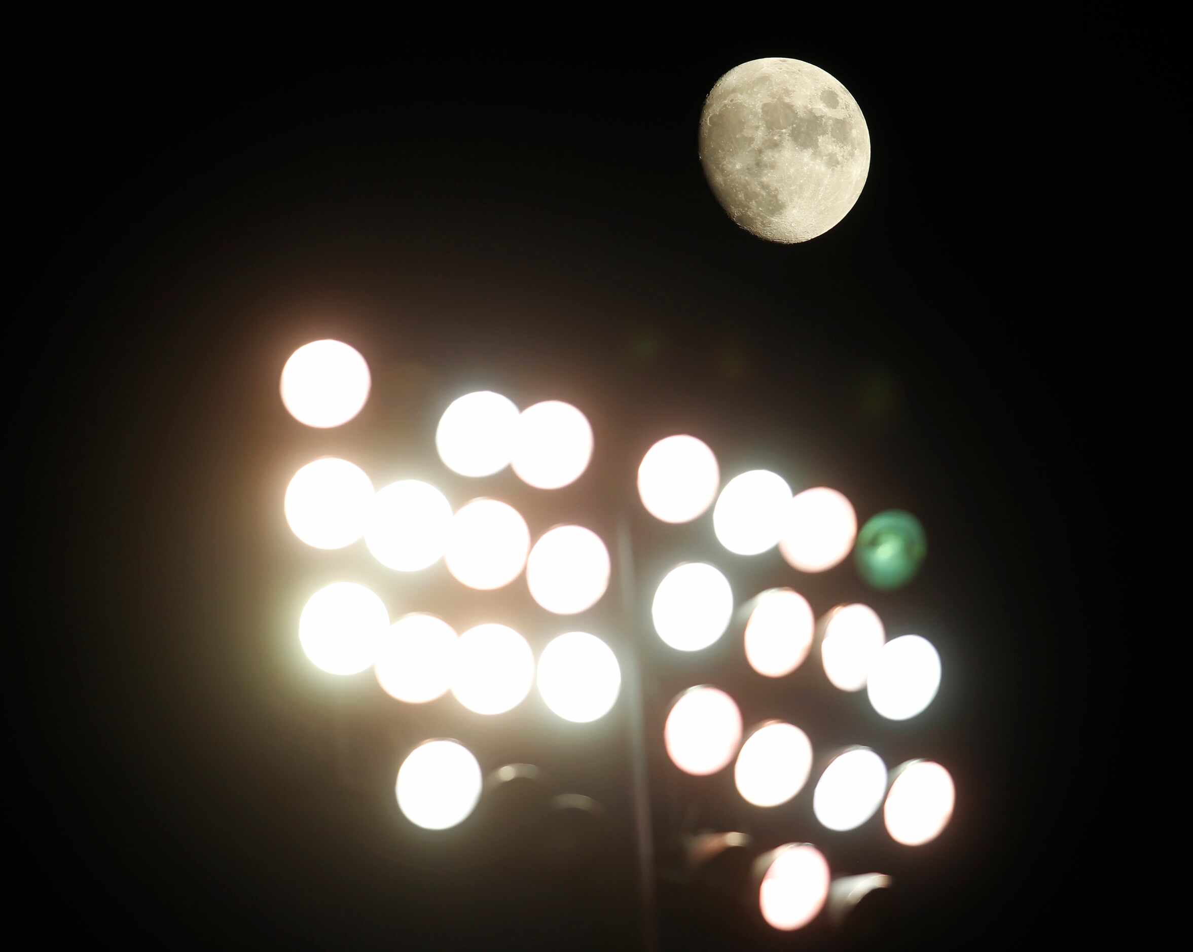 Stadium lights are overshadowed by the moon during first quarter action of the Dallas...