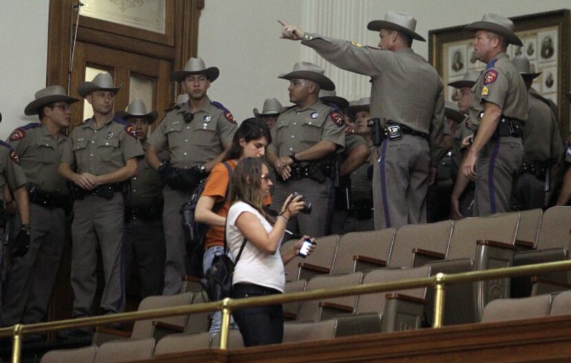 State troopers entered the gallery to try to restore order after the special session ended...
