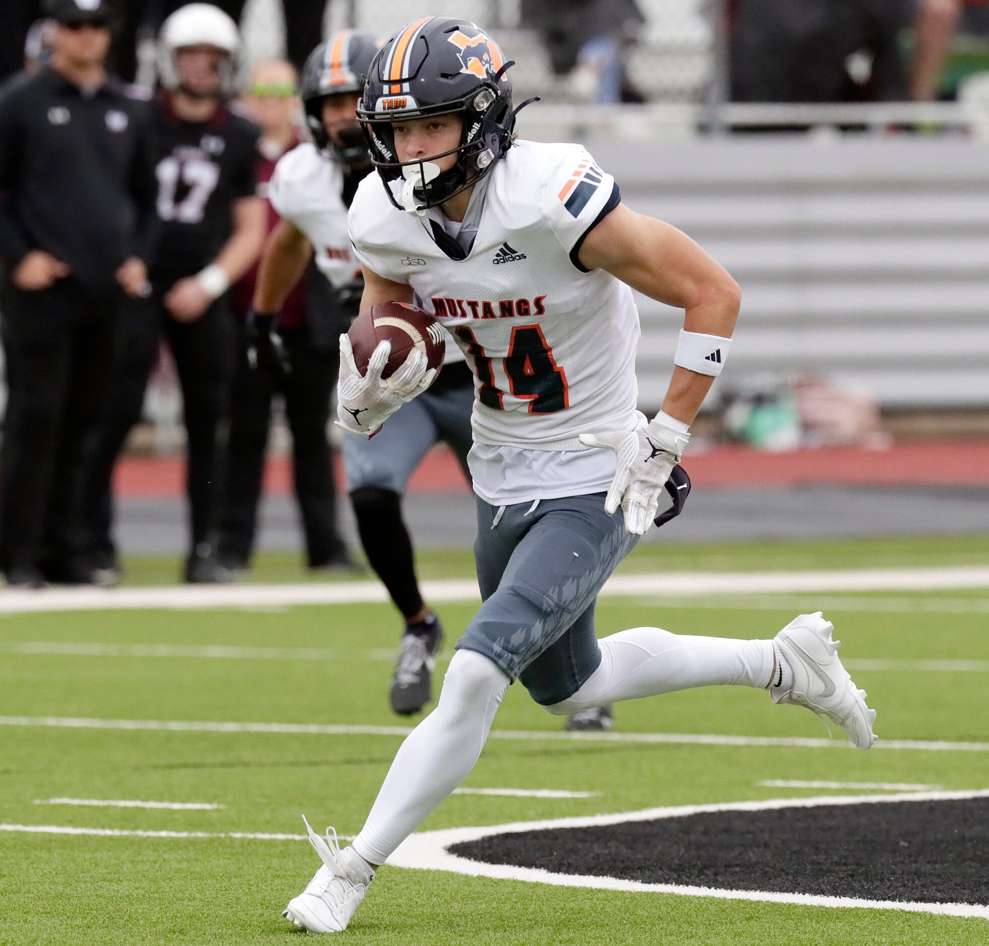 Sachse High School wide receiver Robbie Rothrock (14) heads for the end zone after a catch...