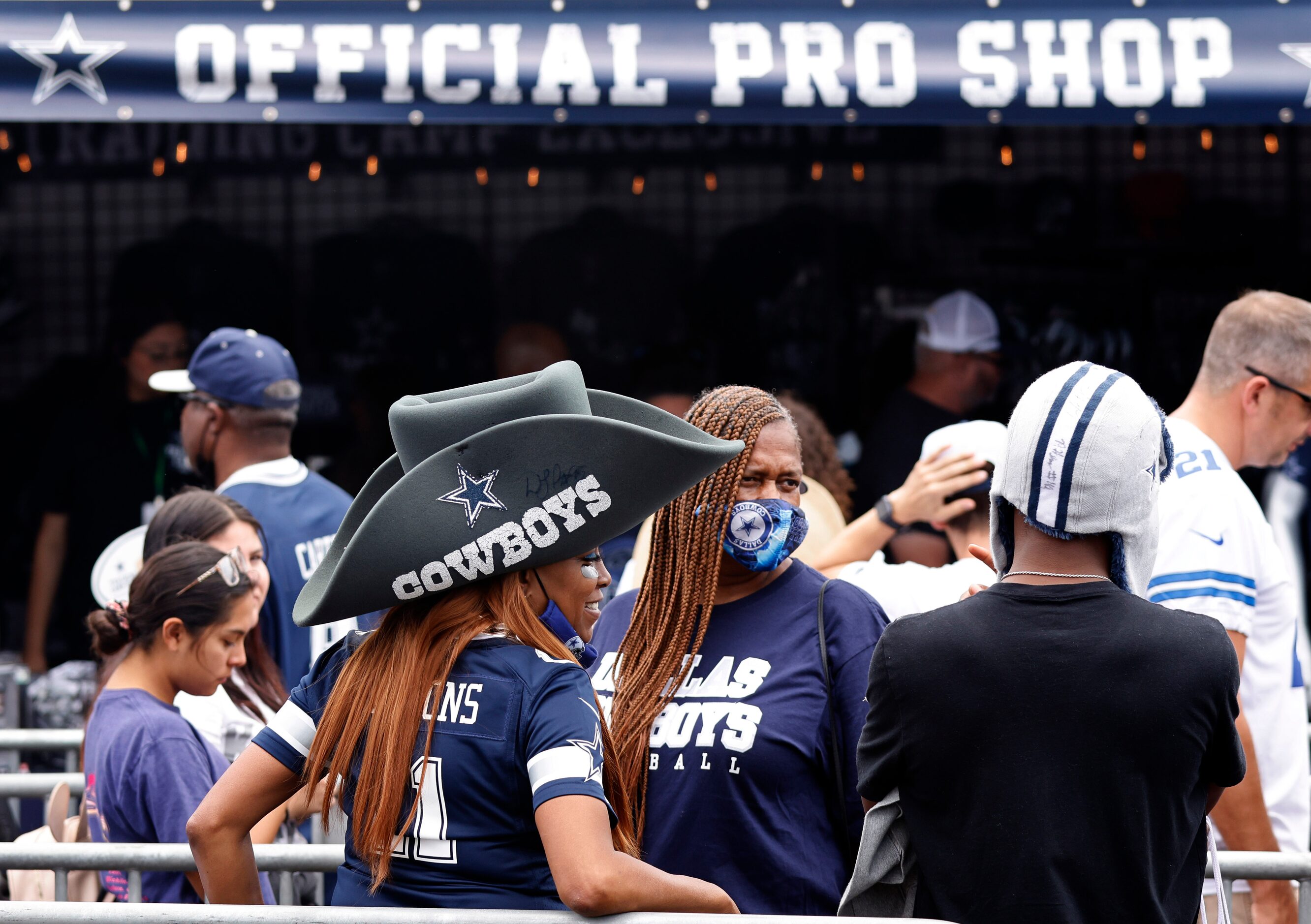 Dallas Cowboys fans wait line for merchandise during the Cowboys training camp opening...