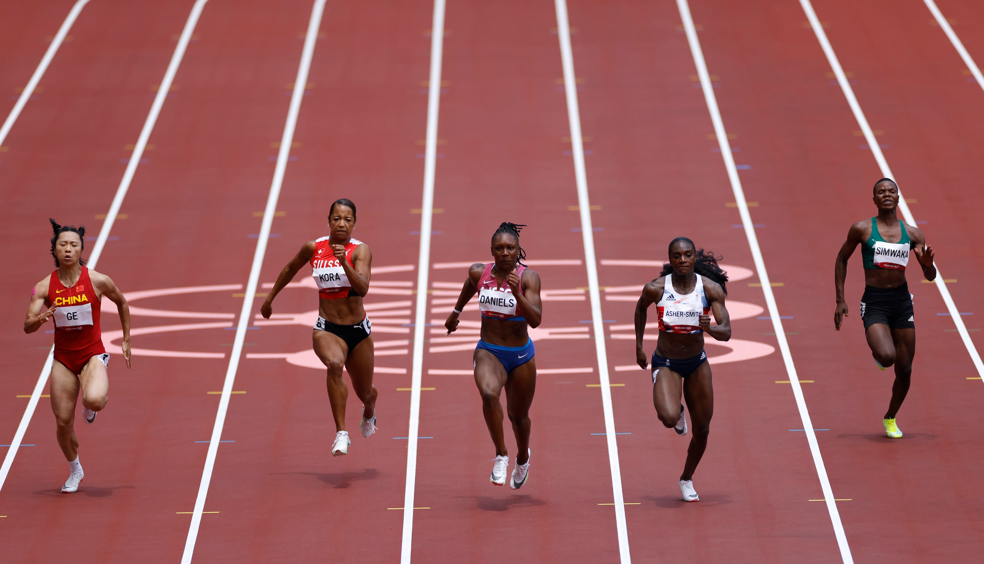 USA’s Teahna Daniels (lane 5) competes in the  women’s  
100 meter race during the postponed...