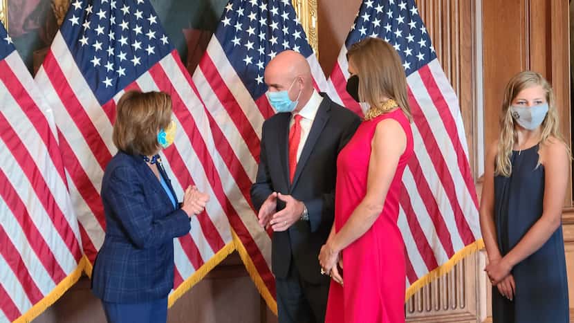 House Speaker Nancy Pelosi chats with newly sworn-in Rep. Jake Ellzey of Ellis County and...