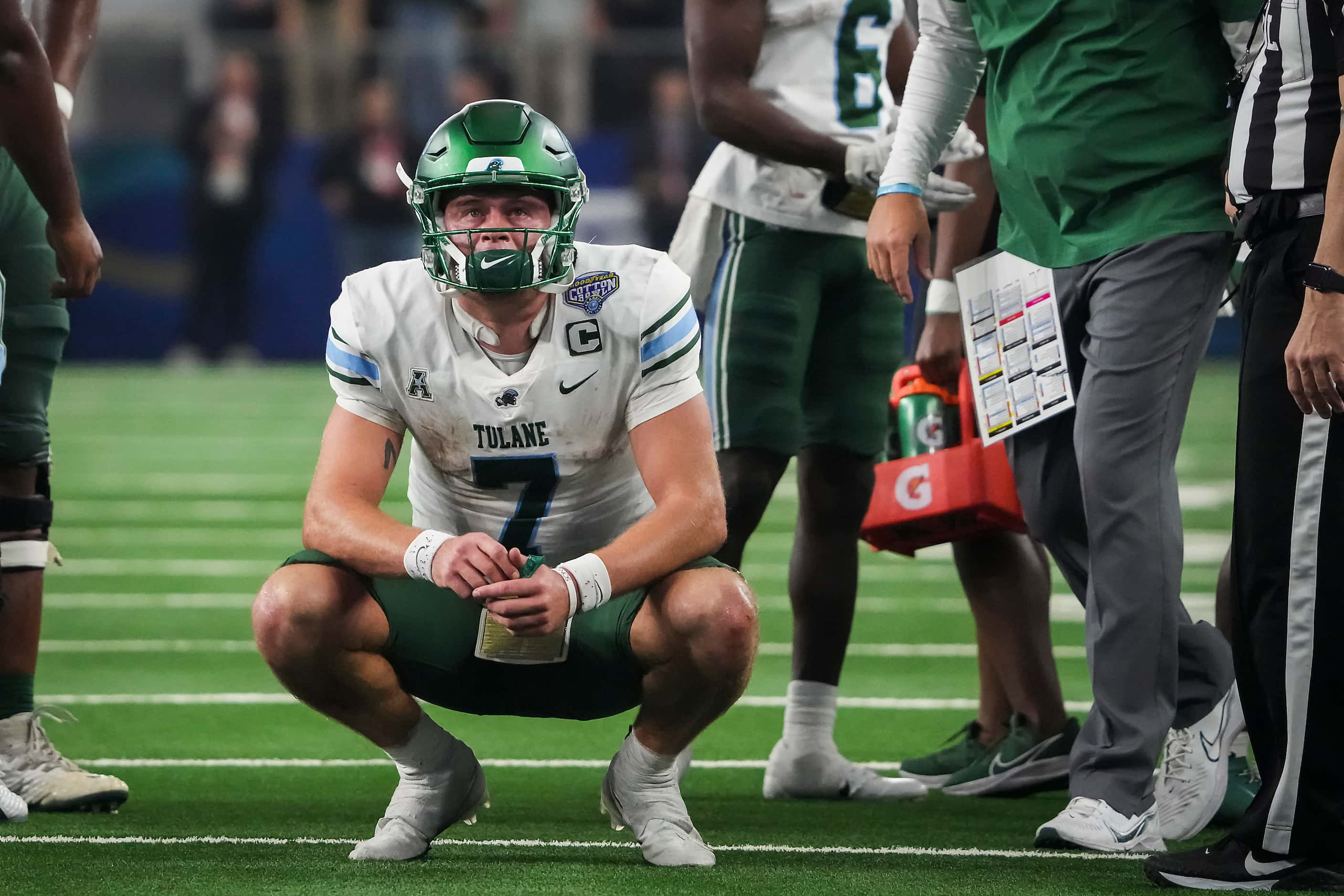 Tulane quarterback Michael Pratt (7) watches a replay after tight end Alex Bauman scored on...