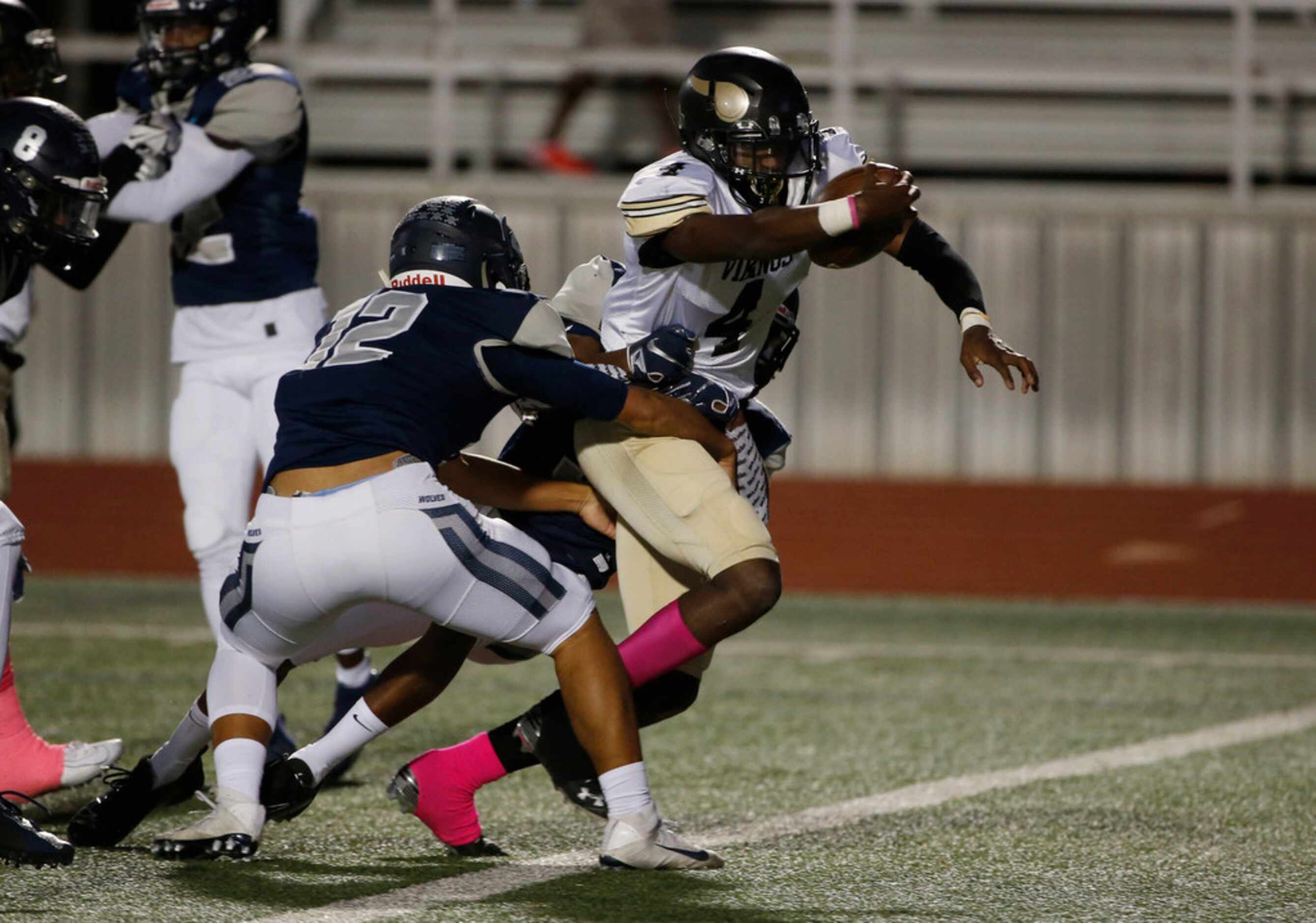 Pinkston's Jamikel Seals (4) scores a touchdown as he is tackled by Ranchview's Shun Mizuno...
