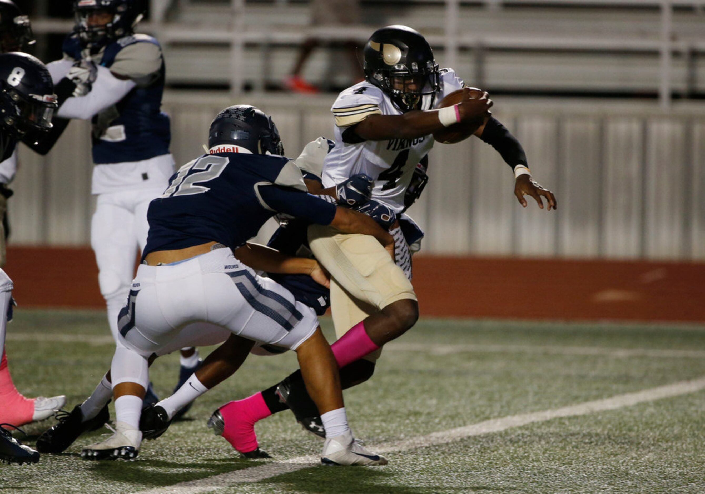 Pinkston's Jamikel Seals (4) scores a touchdown as he is tackled by Ranchview's Shun Mizuno...