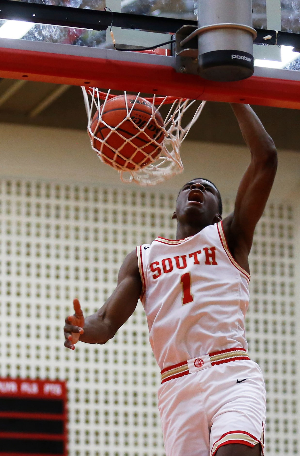 South Grand Prairie's Jaden Flournoy (1) dunks the ball in a game against Arlington Lamar...