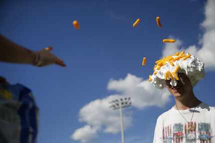 Cheetos are so versatile, aren't they? Anthony Parker, 7, throws Cheetos at family friend...