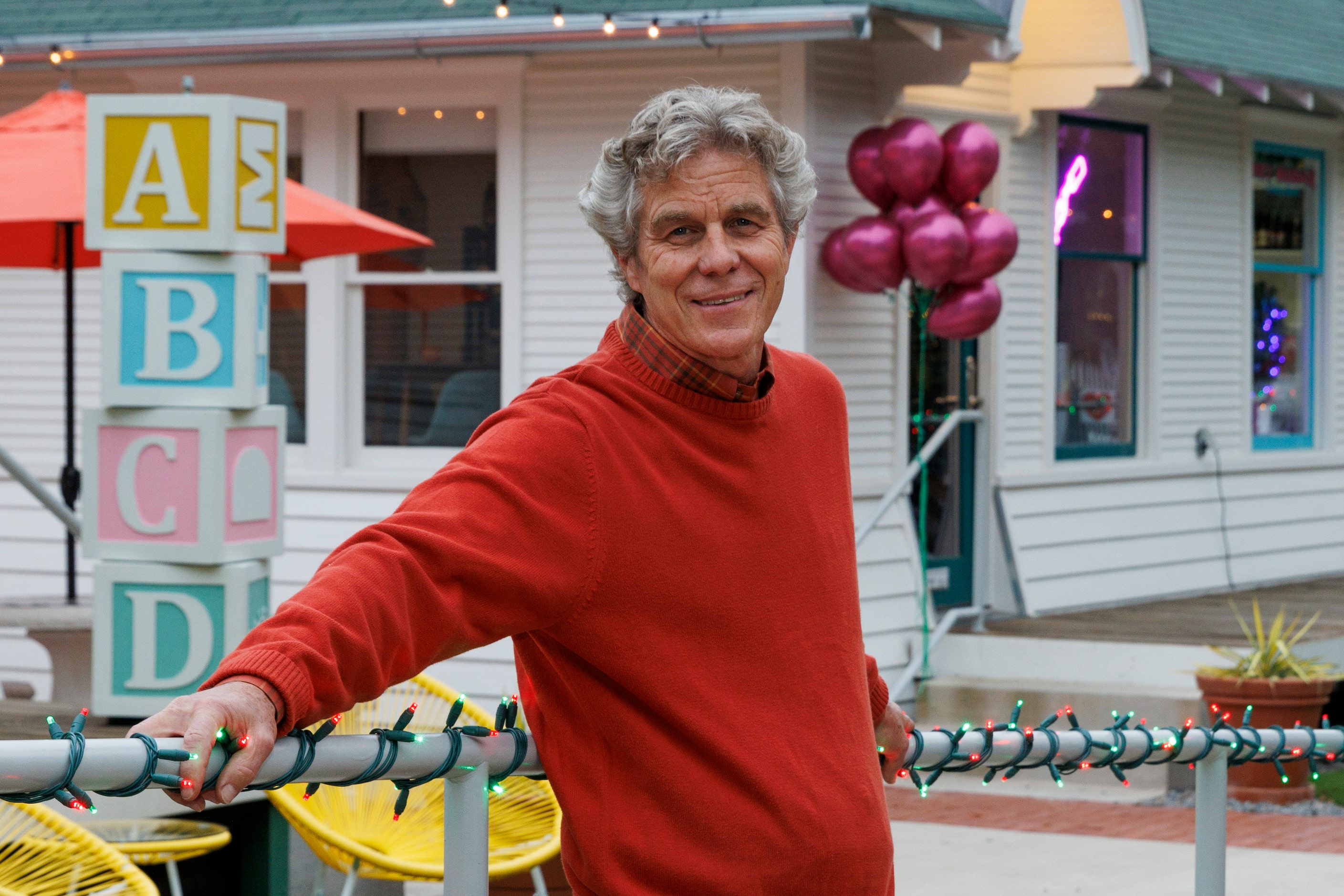 Good Space owner David Spence pictured outside of two remodeled houses turned small...