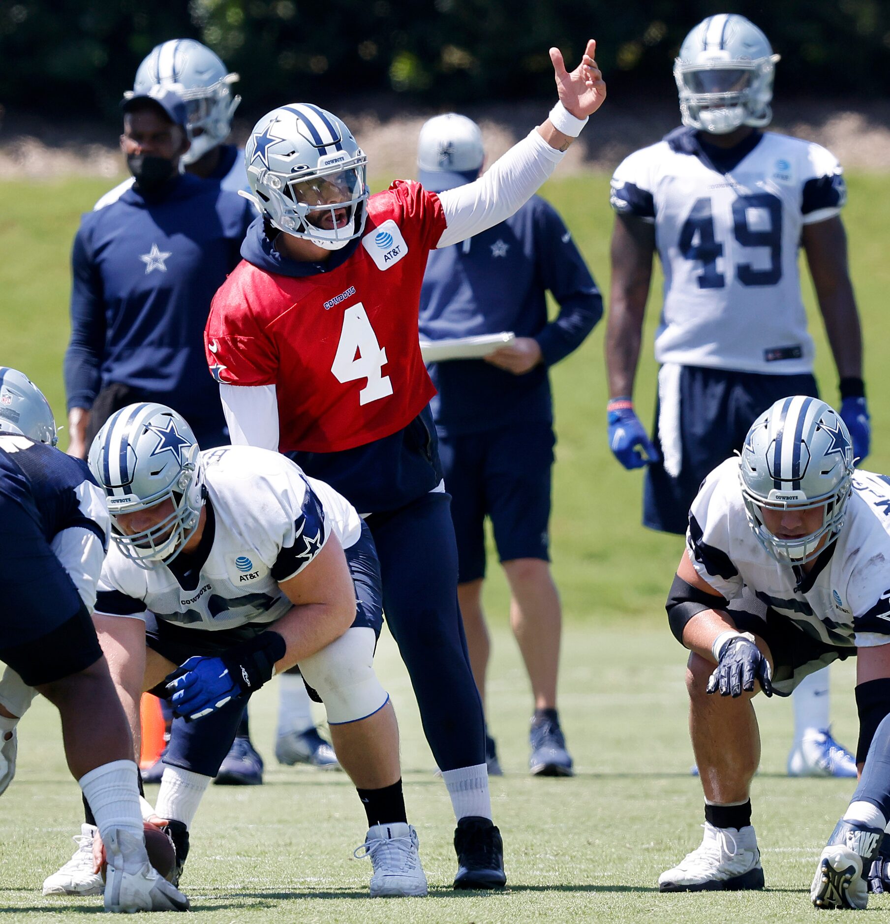 Dallas Cowboys quarterback Dak Prescott (4) signals to his receivers as he steps to the line...