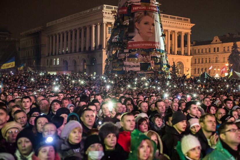 A large photograph of former Prime Minister Yulia Tymoshenko hangs on the side of a...