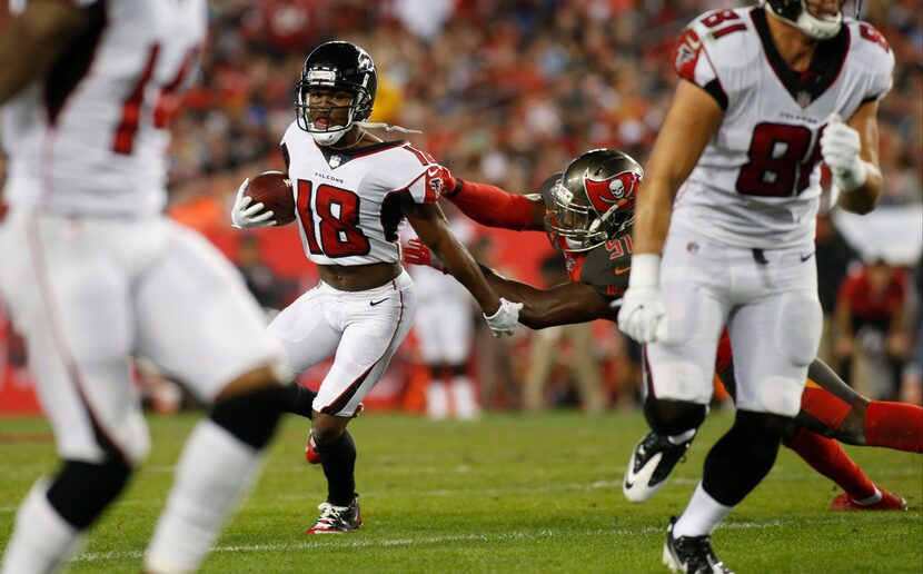 TAMPA, FL - DECEMBER 18:  Wide receiver Taylor Gabriel #18 of the Atlanta Falcons runs for...