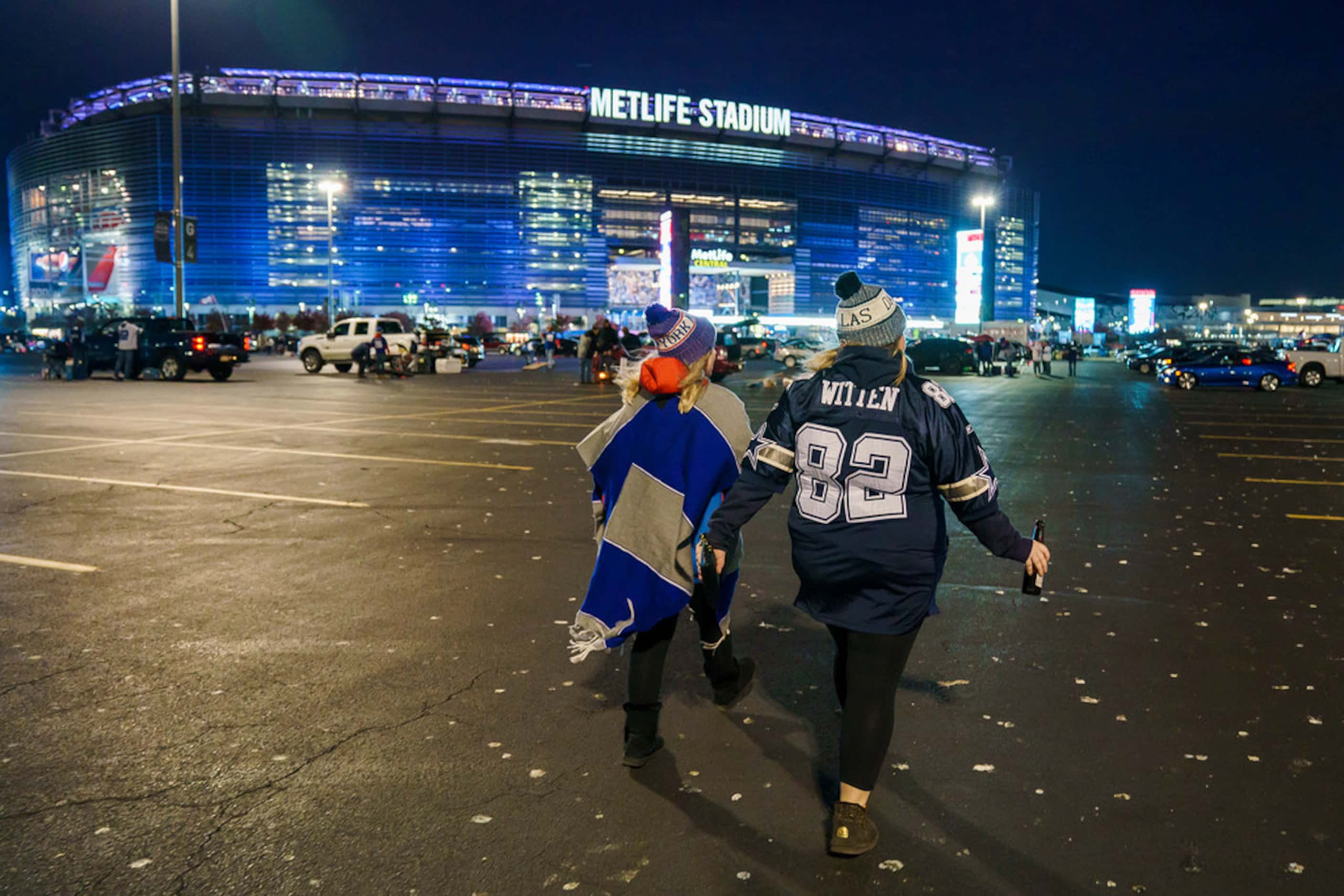 Dallas Cowboys fans head to the stadium before a Monday Night Football game between the...
