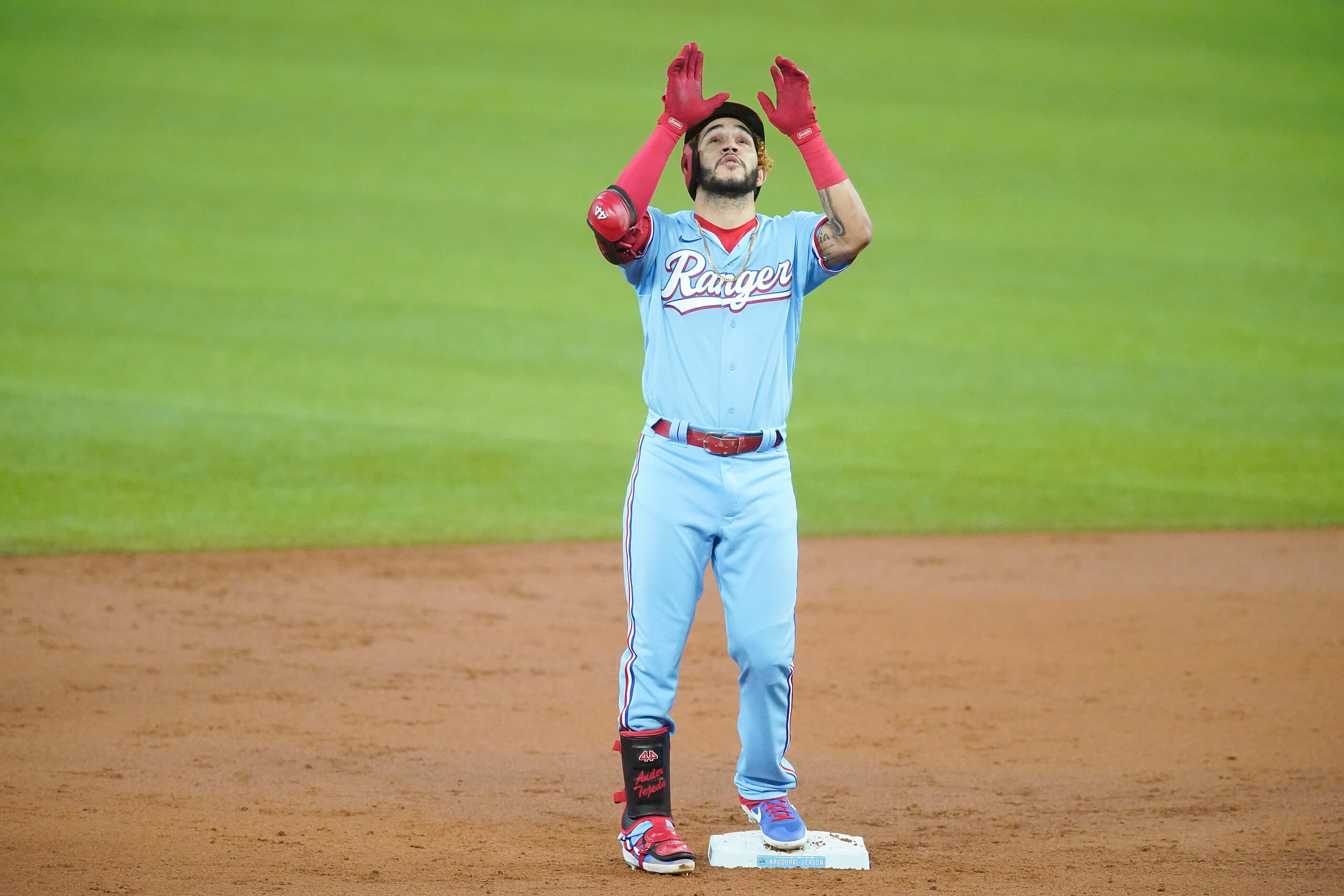 Texas Rangers shortstop Anderson Tejeda celebrates after hitting a double during the second...