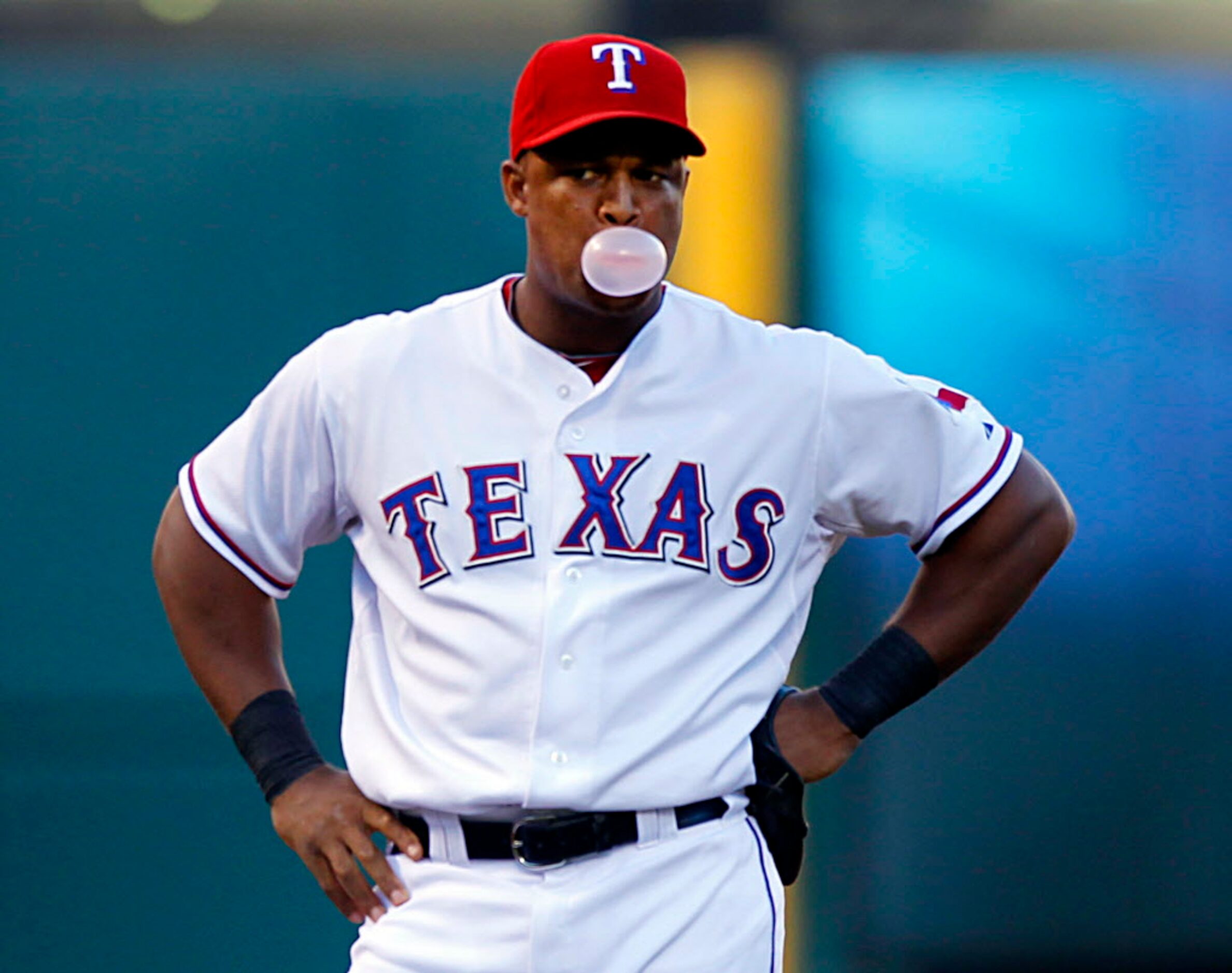 Texas Rangers third baseman Adrian Beltre blows bubble as the first batter come to the plate...