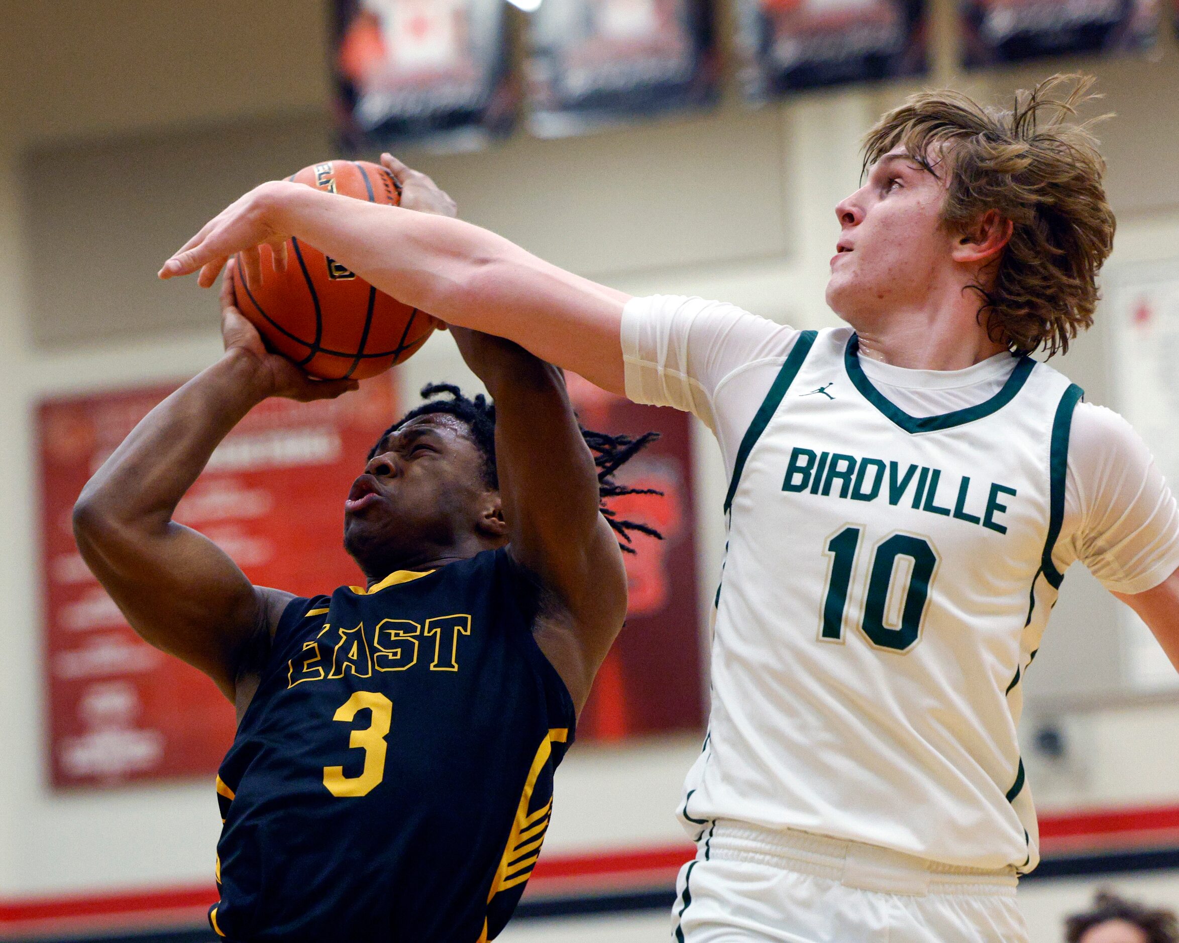 Birdville guard Trent Bowers (10) contests a shot from Plano East guard Isaiah Brewington...