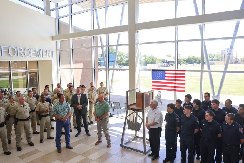 Designers Kolin Zomnir (left) and Danny Jackson speaks during an event unveiling a memorial...