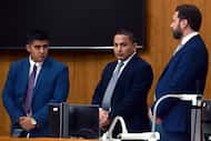 George Alvarez, center, listens and reacts to his sentence alongside his attorneys on...