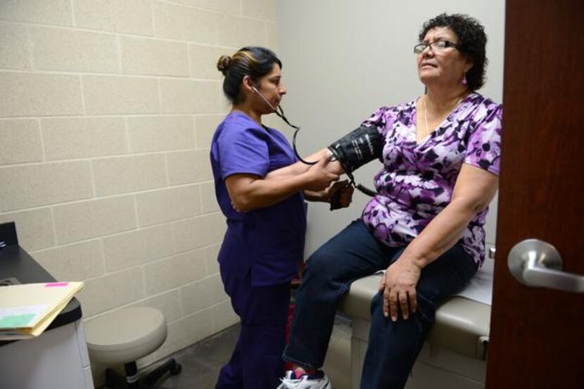 
Medical assistant Rosie Villa checks Maria Aguilar’s blood pressure Nov. 21 at Brother...