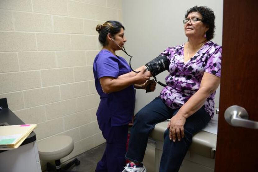 
Medical assistant Rosie Villa checks Maria Aguilar’s blood pressure Nov. 21 at Brother...