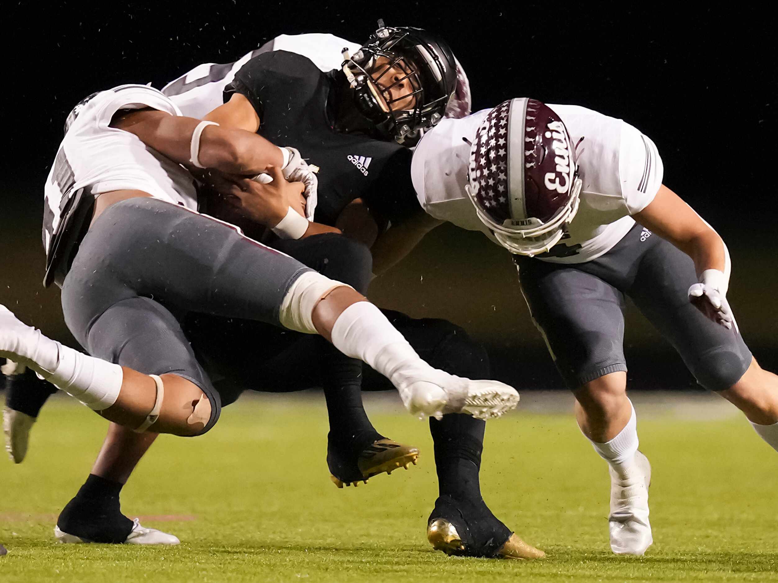 Royce City quarterback Kenneth Spring (13) is brought down by Ennis linebacker Eric Gonzalez...