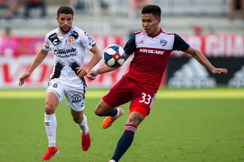 FC Dallas midfielder Edwin Cerrillo (33) takes control of the ball ahead of Club Tijuana...