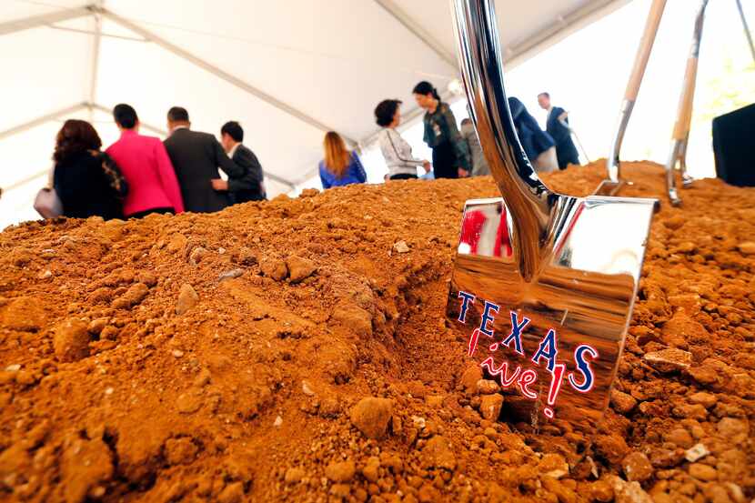 A ceremonial shovel is left in the dirt following the groundbreaking for Texas Live! in...
