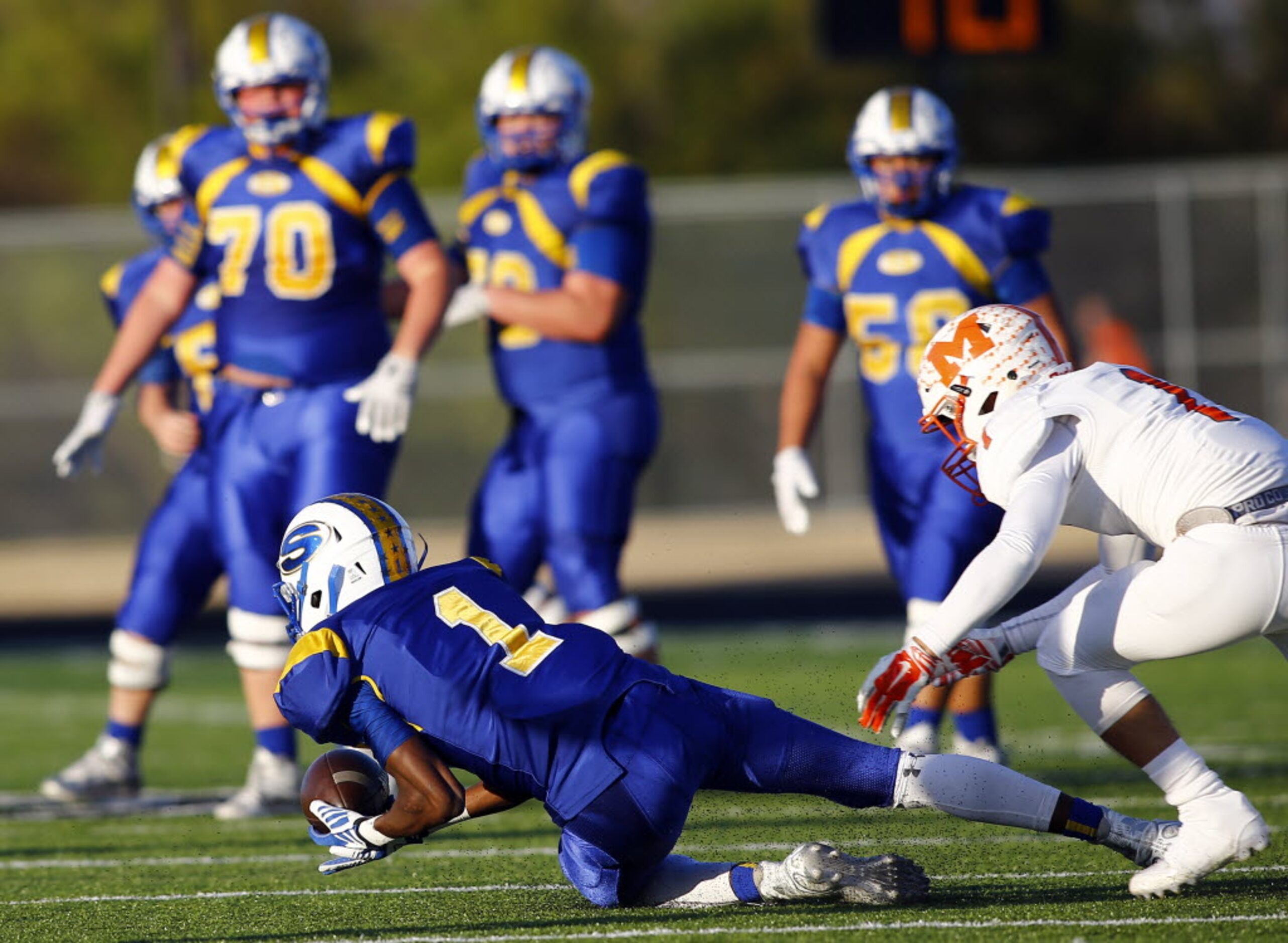 TXHSFB Sunnyvale's Chima Enyinna (1) dives to the ground but is unable to make the catch as...