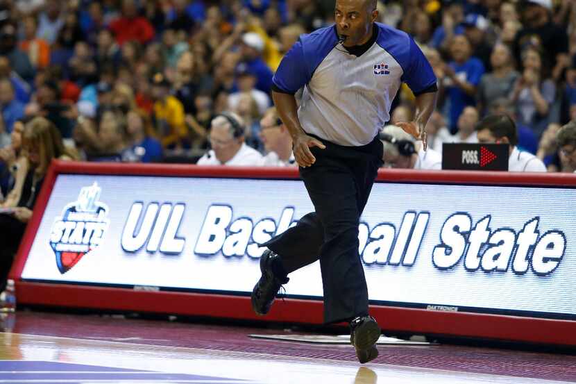 Referee Billy Gaines works the Class 3A boys basketball UIL state final between Dallas...