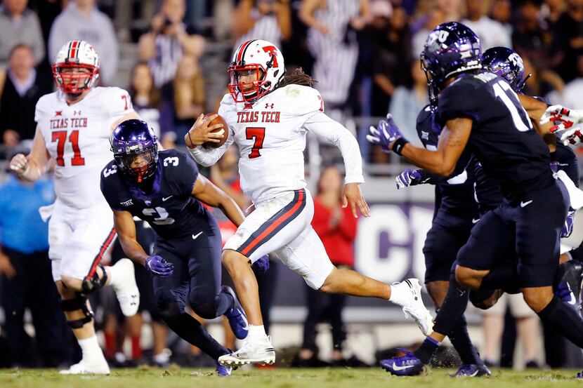 Texas Tech Red Raiders quarterback Jett Duffey (7) races down the middle of the field for a...