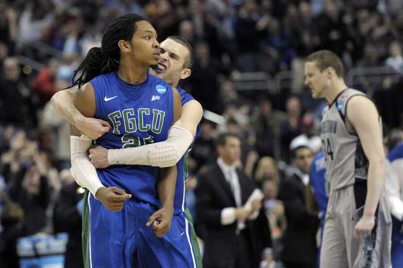 Florida Gulf Coast's Sherwood Brown, left, and Brett Comer celebrate after Brown's basket...