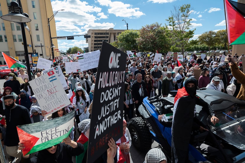 Palestine supporters march on Ervay Street during a protest titled "All Out for Palestine"...