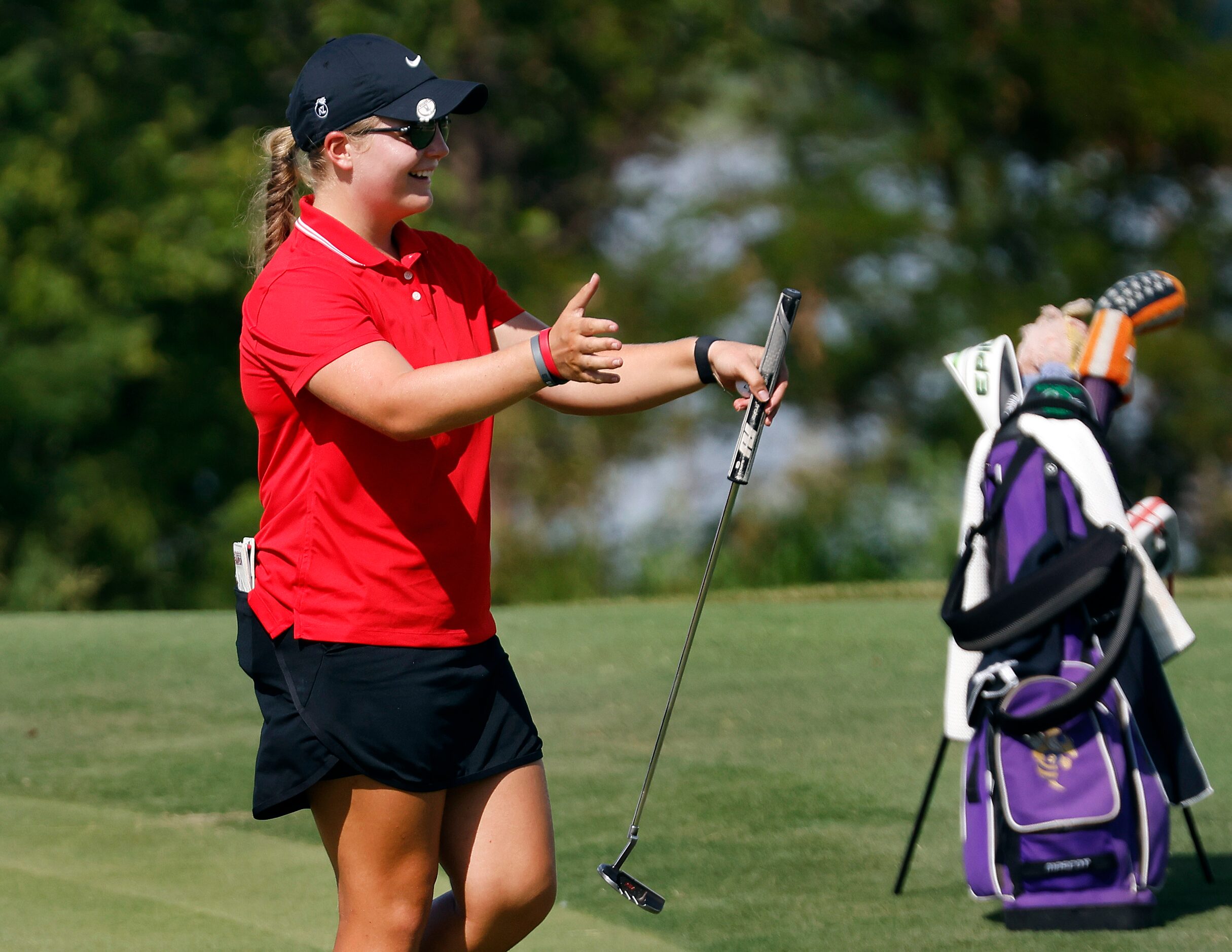 Amateur golfer Avery Zweig, 14, of McKinney celebrates her first birdie of the LPGA VOA...