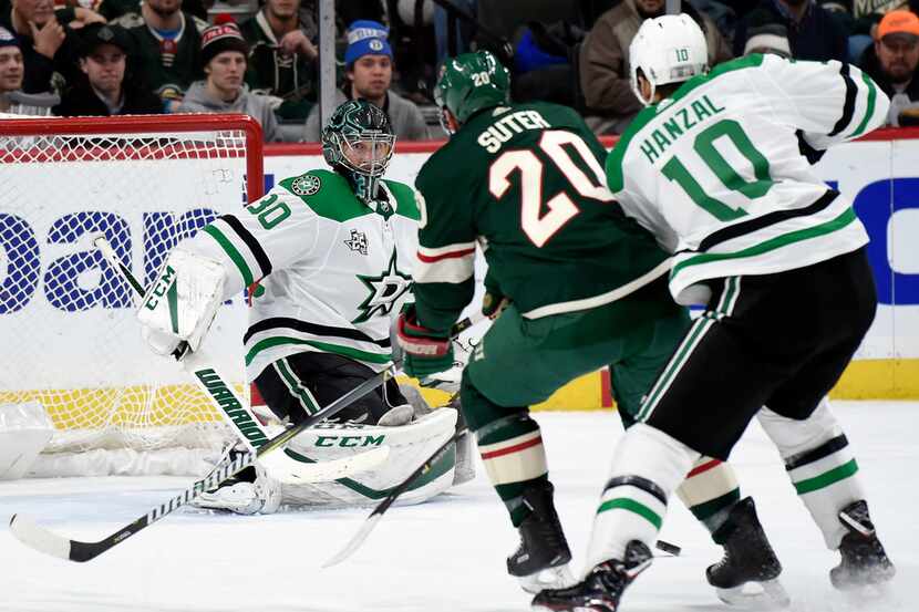 Dallas Stars goalie Ben Bishop (30) watches as center Martin Hanzal (10), of the Czech...