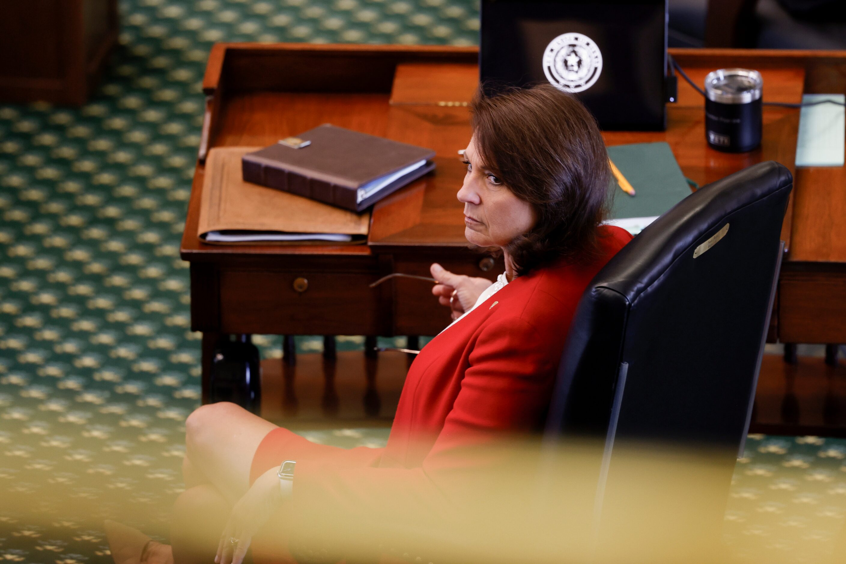 Sen. Angela Paxton, R-McKinney, sits at her desk during the first day of her husband’s,...