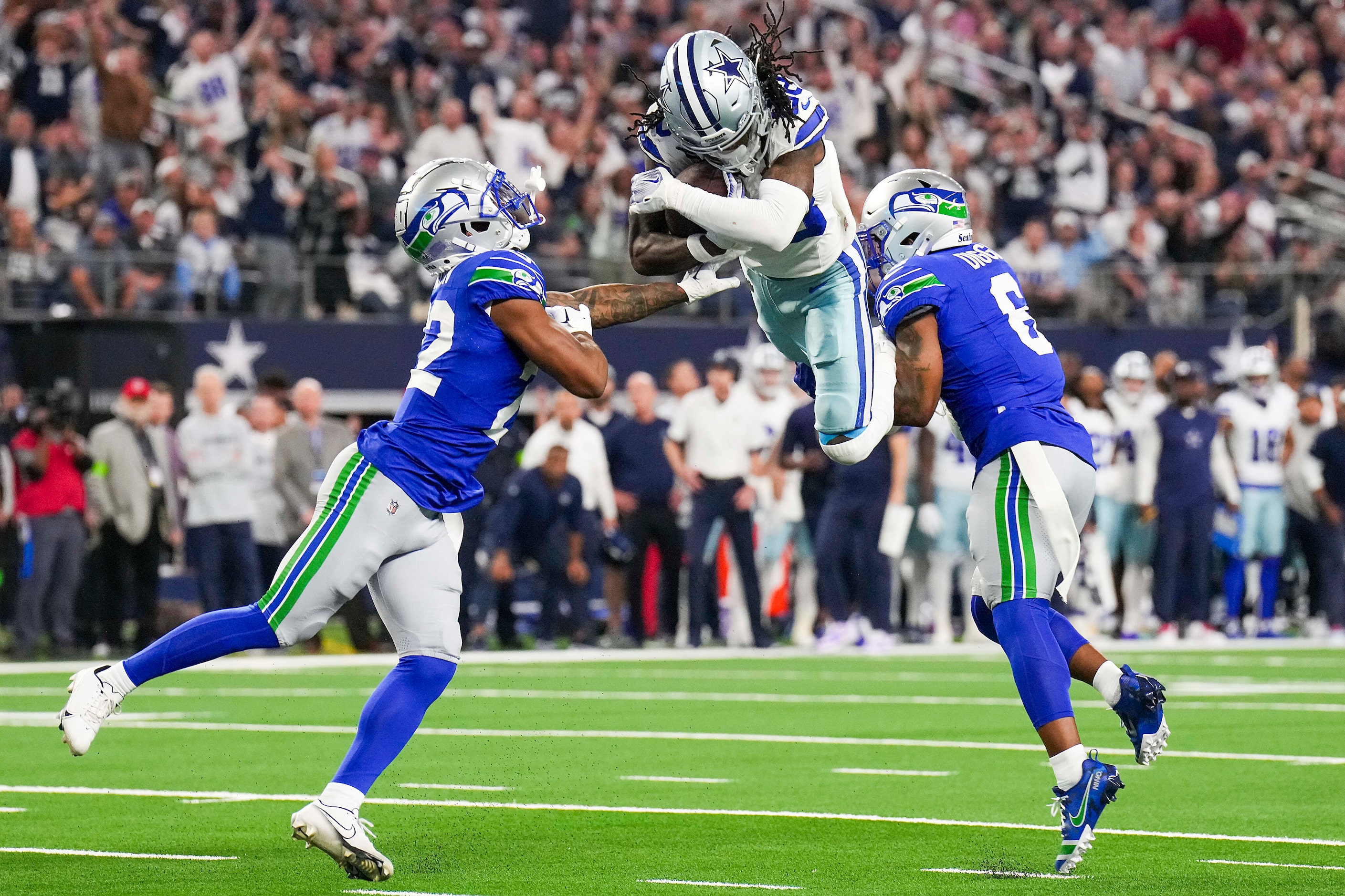 Dallas Cowboys wide receiver CeeDee Lamb (88) can’t hurdle his way in to the end zone as...