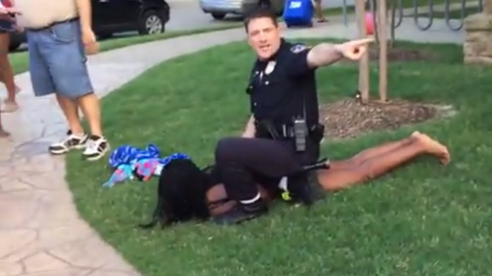 McKinney police Cpl. Eric Casebolt warned others away as he handcuffed a teenage girl...