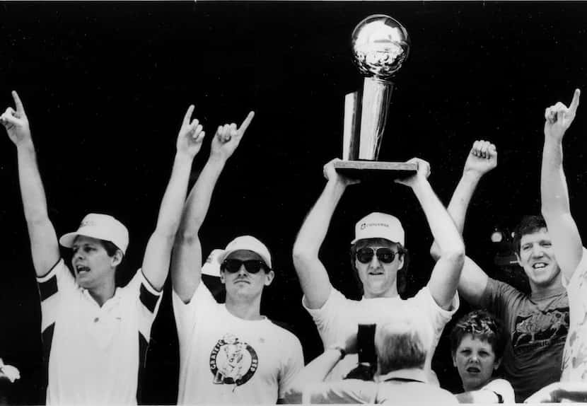 Rick Carlisle (second from left) as the Celtics celebrate the 1986 NBA title. (AP Photo)