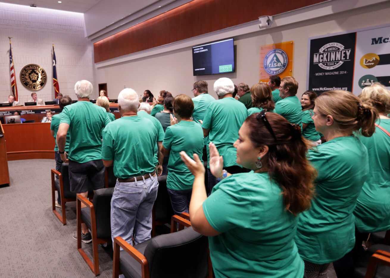 Mckinney residents show their opposition regarding a plan to expand U.S. Highway 380 during...