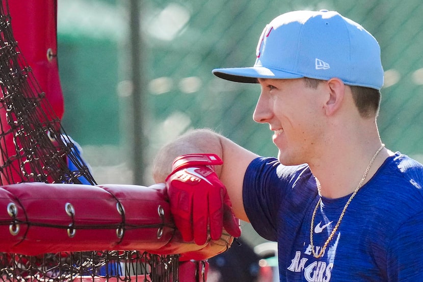 Texas Rangers outfielder Wyatt Langford watches a teammate take batting practice during a...