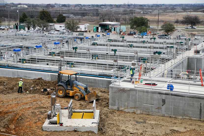 Construction crews work on upgrades to the Plant 1 settling basins at the North Texas...