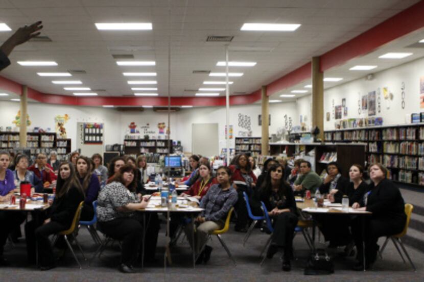 Jeanae Beal teaches a diversity training course to the staff at Toler Elementary School in...