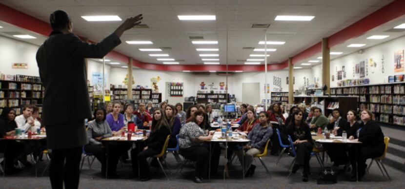 Jeanae Beal teaches a diversity training course to the staff at Toler Elementary School in...