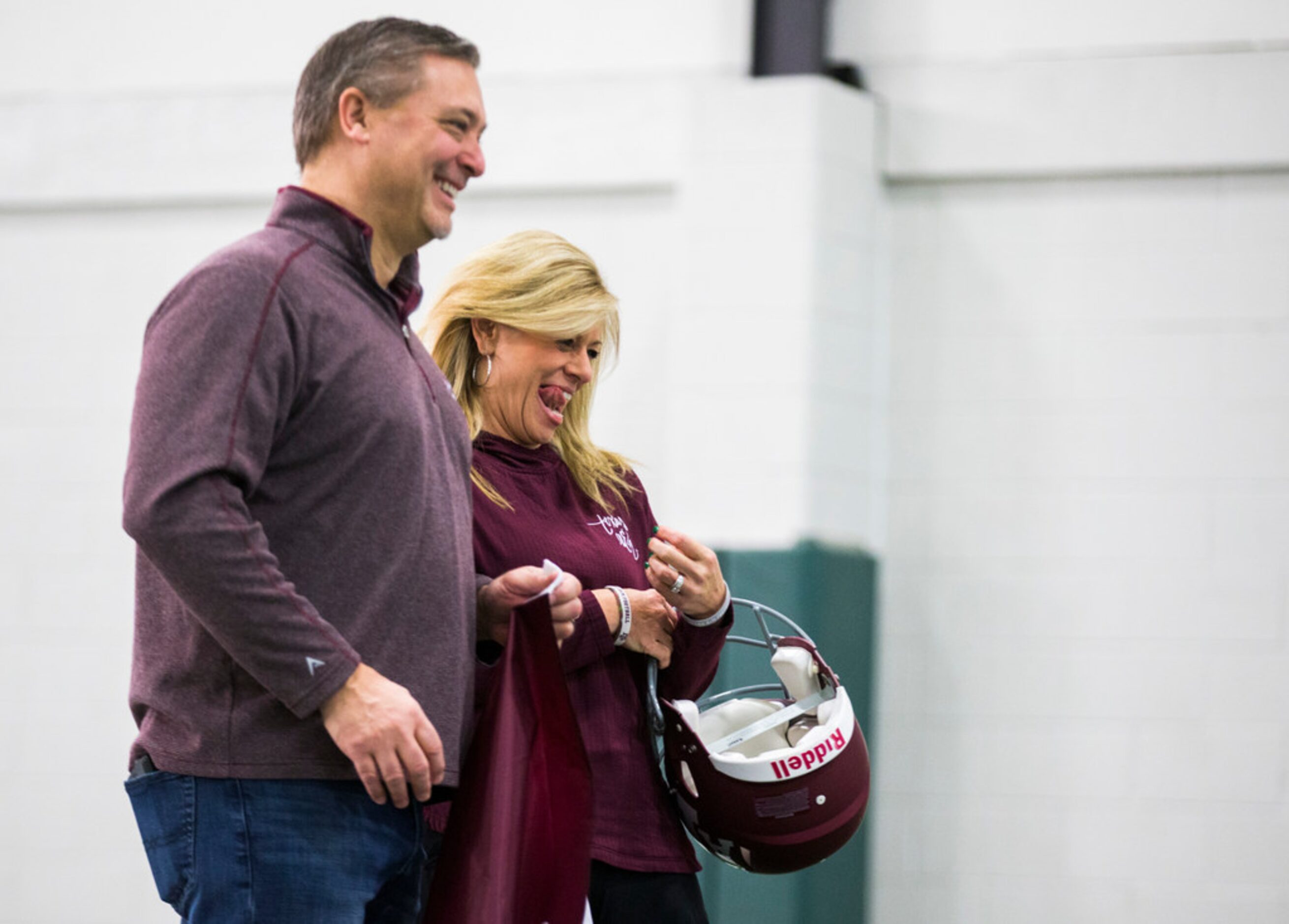 Rob Smith and Renee Smith react as their son, Southlake Carroll football player Blake Smith,...