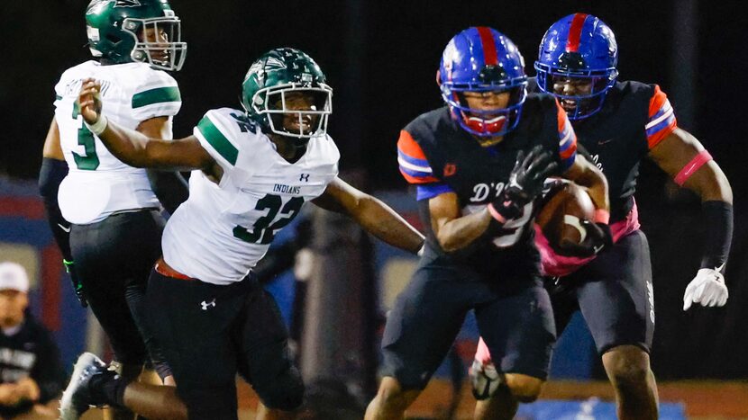 Duncanville running back Caden Durham (29) breaks free from Waxahachie line backer La’Markus...